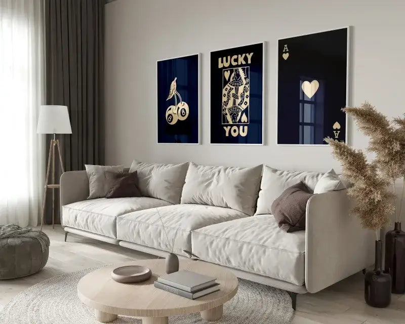 Beige upholstered sectional sofa with soft modern design and dark brown accent pillows beside hearts wall art set