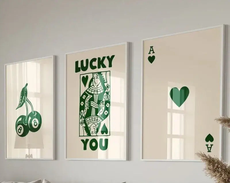 Set of three framed wall art prints by DecorBites featuring green playing card and lucky charm hearts wall art on cream background