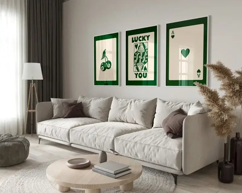 Three framed green and cream hearts wall art pieces from decorbites™ 3-piece retro queen of hearts art set above gray sofa