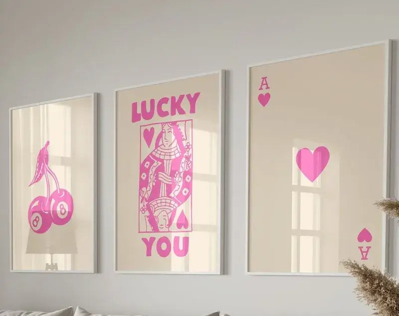 DecorBites™ 3-piece retro queen of hearts wall art set featuring pink playing card designs on beige background
