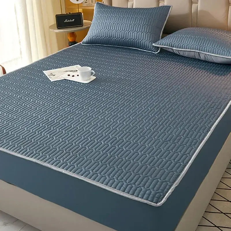 Blue quilted latex fitted sheet set with subtle geometric pattern and white piping for bedroom cooling mattress pad