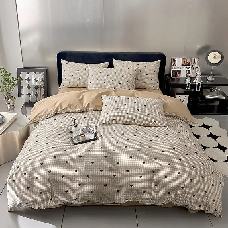 Beige and black heart-patterned quilted cream and black geometric printed bed set with soft textured fabric finish