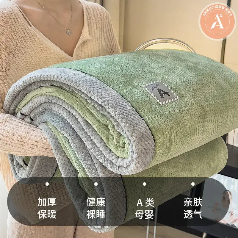 Quilted cream and gray plush blanket with textured green and gray fleece surface from decorbites cozy cotton velvet collection