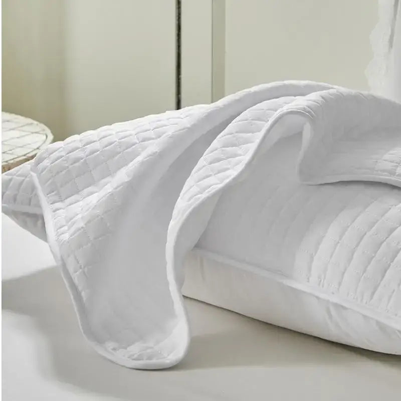 White quilted cotton throw blanket with diamond-stitched pattern complementing decorbites cotton pillowcase bedroom cover