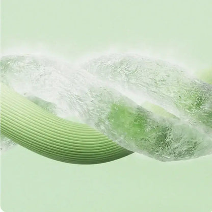 A sleek ribbed green hose with a translucent water-filled section shown alongside a quilted pink bed skirt set with silver trim