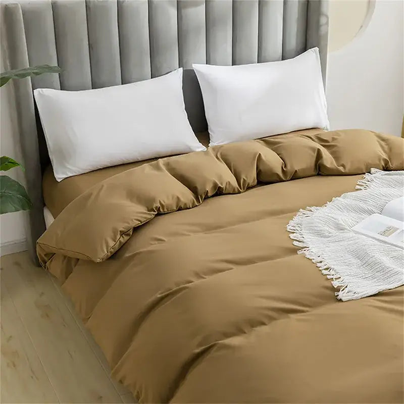 Quilted tan duvet cover set with matching pillowcases featuring a soft textured fabric for comfortable bedding