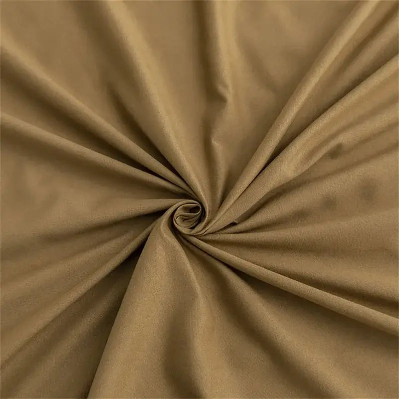 Quilted tan duvet cover set with smooth textured fabric and subtle sheen featuring gentle folds in soft bedding cover set