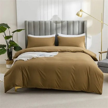 Quilted tan duvet cover set with warm caramel color and soft smooth fabric finish including matching pillowcases