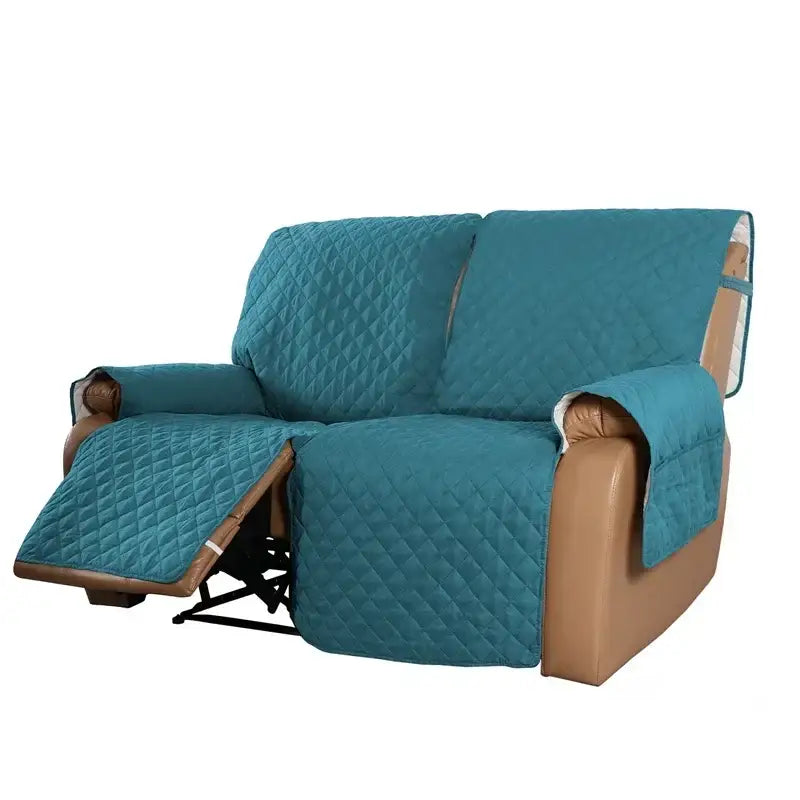 Quilted teal recliner slipcover with diamond stitching and brown leather trim for living room furniture protection
