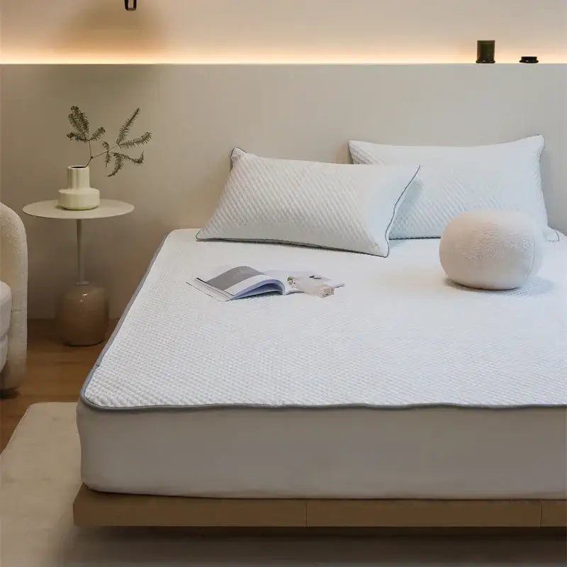 White quilted cooling mat and pillowcase set with subtle gray border from decorbites ice bean for bedroom use