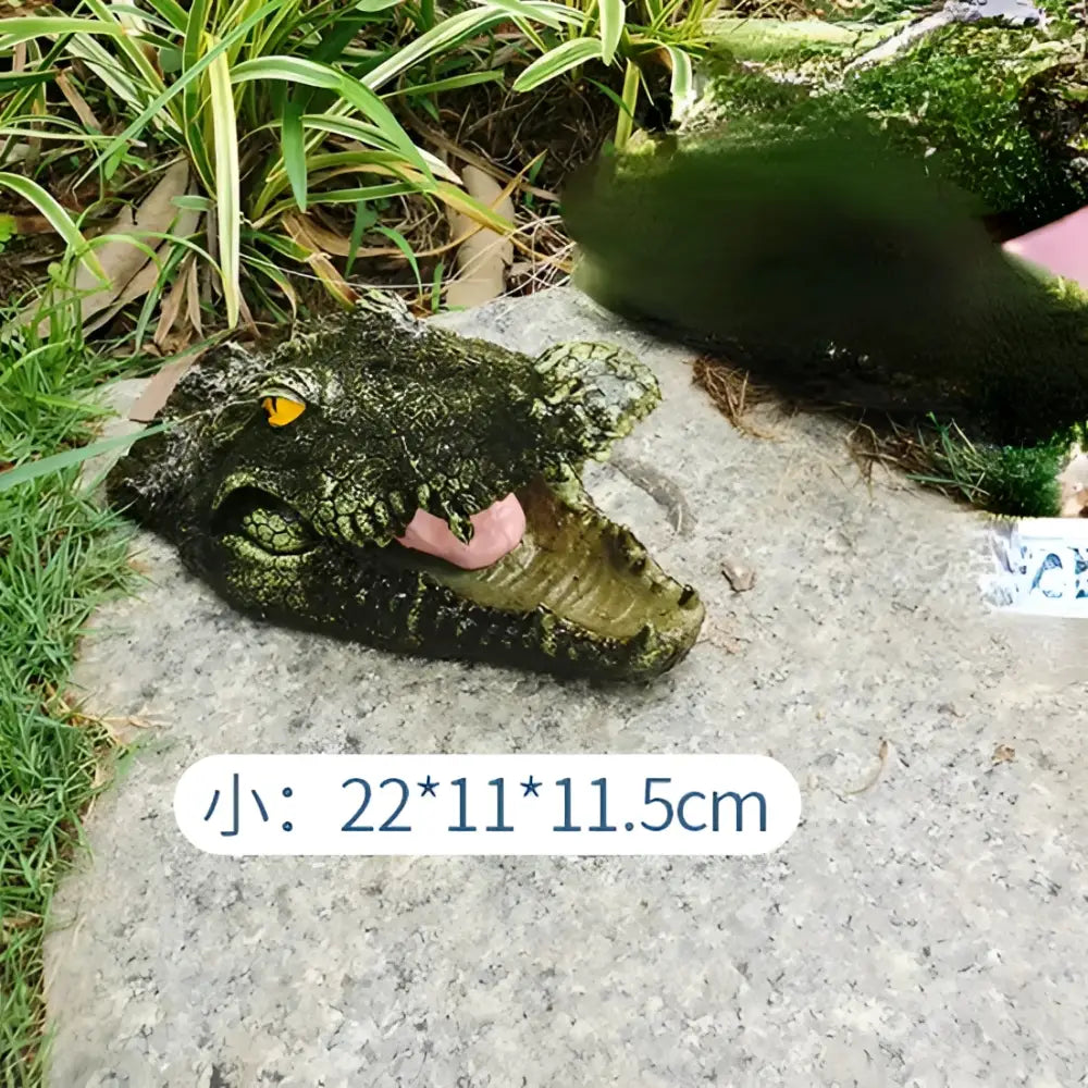 Realistic dark green and beige floating crocodile head garden water decor with textured scales yellow eyes and pink tongue for decorbites garden water