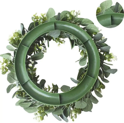 Green plastic eucalyptus leaf wreath with white flowers by decorbites for living room decor