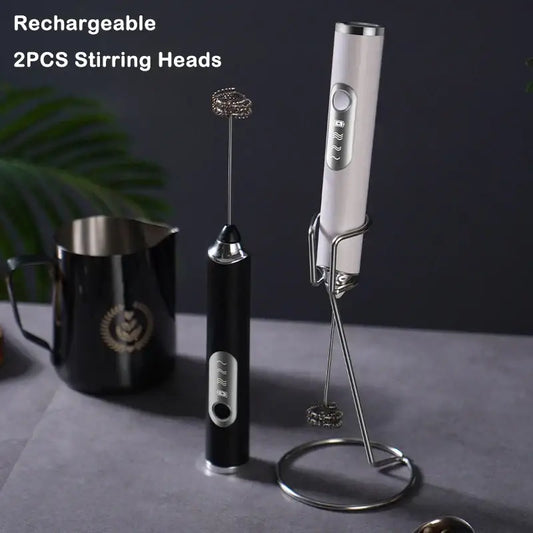 Rechargeable black and silver electric milk frother with stainless steel whisk attachment for kitchen use
