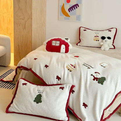 Red and white plush bedding set with cartoon embroidered holiday designs including santa christmas tree and bows for decorbites