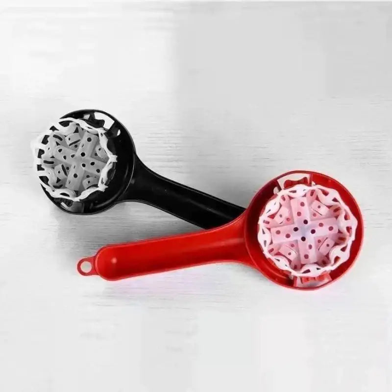 Black and red plastic fruit juicers with white and pink silicone inserts for espresso machine cleaning brush use