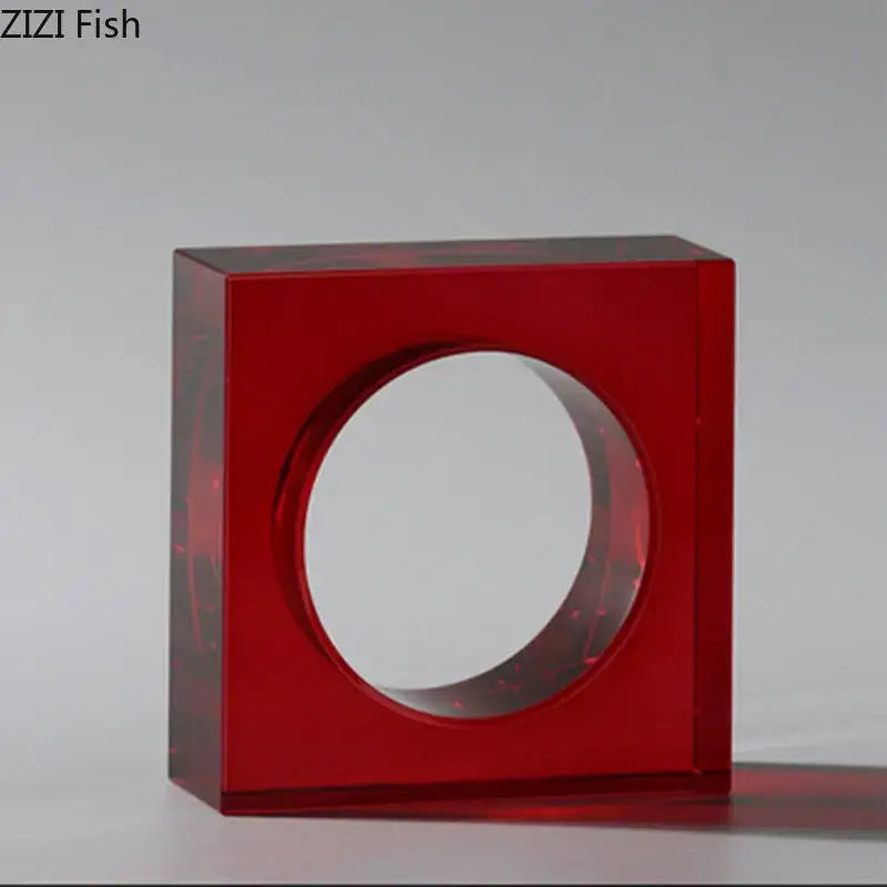 Vibrant red translucent acrylic square ring holder with central circular cutout for crystal arch glass sculpture decor