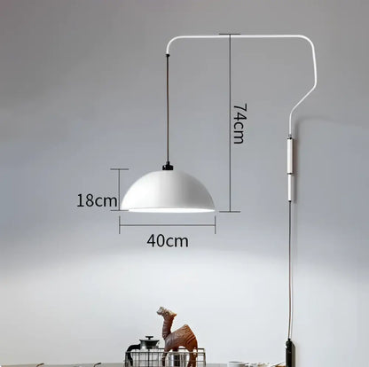 White enamel dome adjustable pendant light with a sleek curved wall-mounted arm for kitchen island lighting