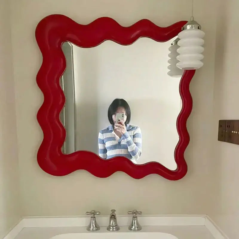 Vibrant red glossy cream cloud wave mirror with wavy edges for bedroom makeup decor by decorbites cream cloud