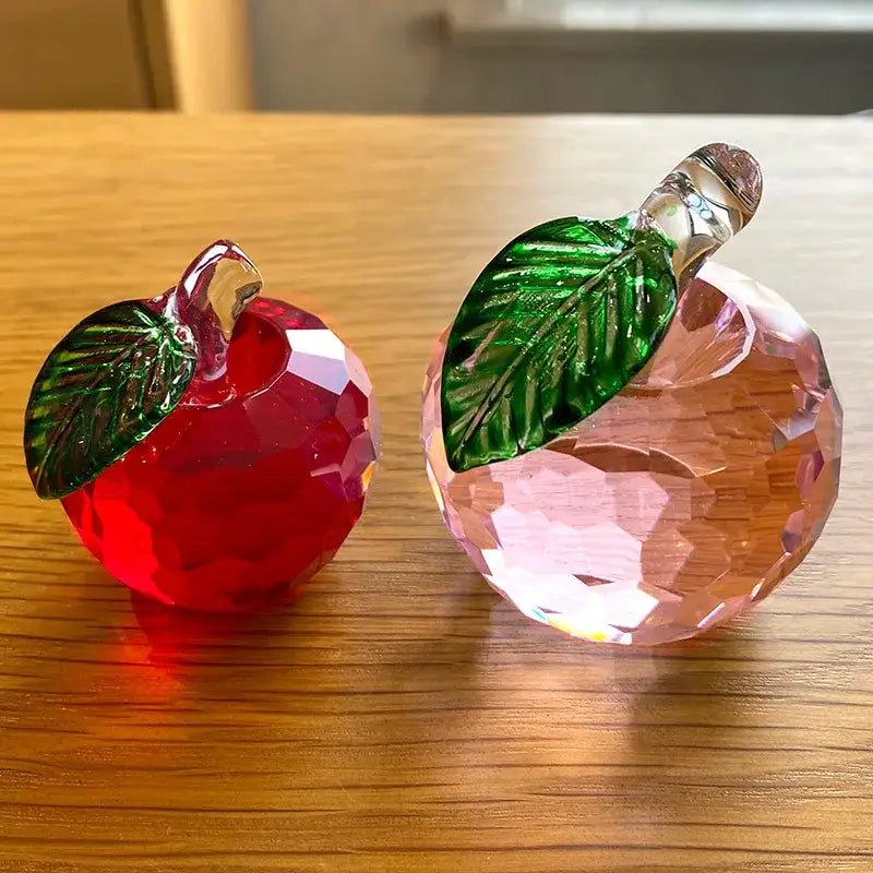 A vibrant red and soft pink faceted decorbites 3d crystal yellow apple figurines with detailed green leaves for office decor