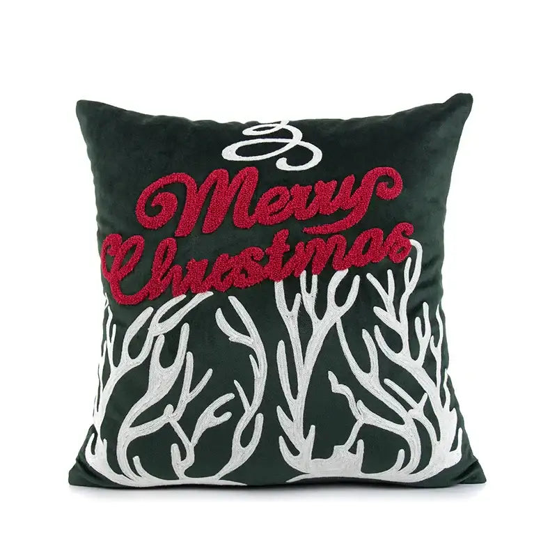 Dark green velvet pillow cover with red and white embroidered christmas text and white antler decorbites embroidered christmas pillow