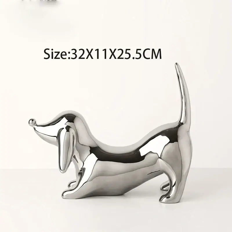 Shiny silver metallic dachshund art statue in playful pose perfect for home decor and decorbites doberman collection