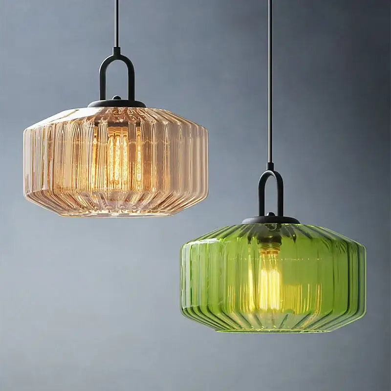 Two hanging pendant lights with amber and green ribbed color glass shades in black metal for dining chandelier decorbites color glass