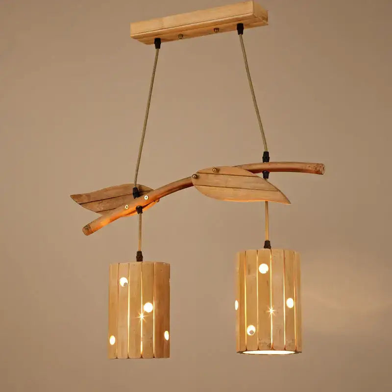 Natural wood retro bamboo art chandelier with two cylindrical slat lanterns suspended by ropes for dining room lighting