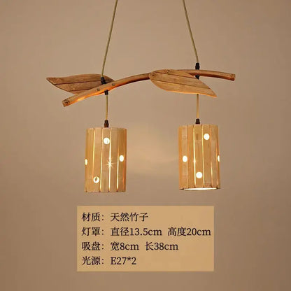 Natural bamboo art chandelier with two cylindrical shades and leaf-shaped accents for dining room lighting
