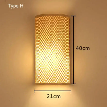 A warm-toned retro bamboo wall light with woven lattice design in rattan measuring 40cm by 21cm