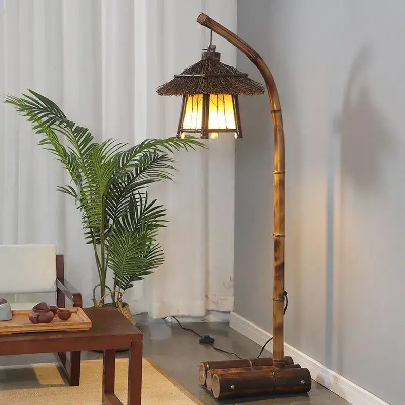 Retro bamboo weave floor lamp with thatched roof shade and warm glowing light for zen living room ambiance