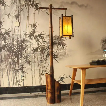 Retro bamboo weave floor lamp with warm yellow lantern and bamboo weave floor design for zen living room lighting