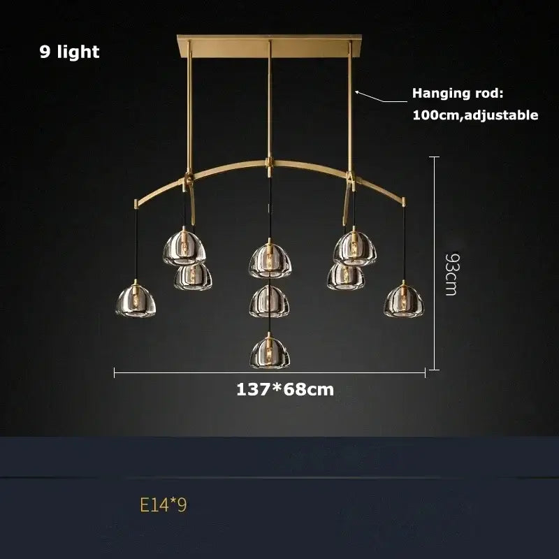 Gold-toned retro black brass chandelier with nine clear glass bell shades on an arched frame for dining room decorbites black brass