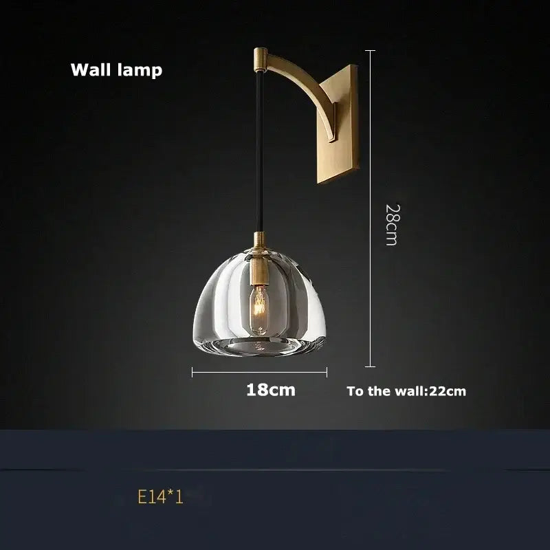 A modern brass retro crystal wall lamp with clear dome glass shade and exposed filament bulb for decorbites black brass style