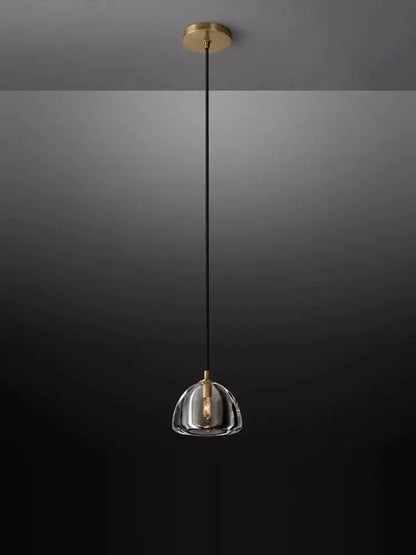 A sleek decorbites black brass retro pendant light with clear crystal glass dome for modern dining room decor