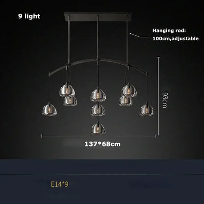 Modern black brass retro chandelier with nine clear glass globe shades ideal for dining room decorbites black brass