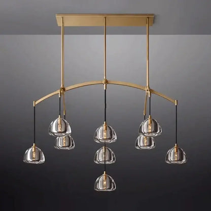 Retro black brass pendant light with gold-toned chandelier, clear glass dome shades, and black cords for dining room decorbites black brass