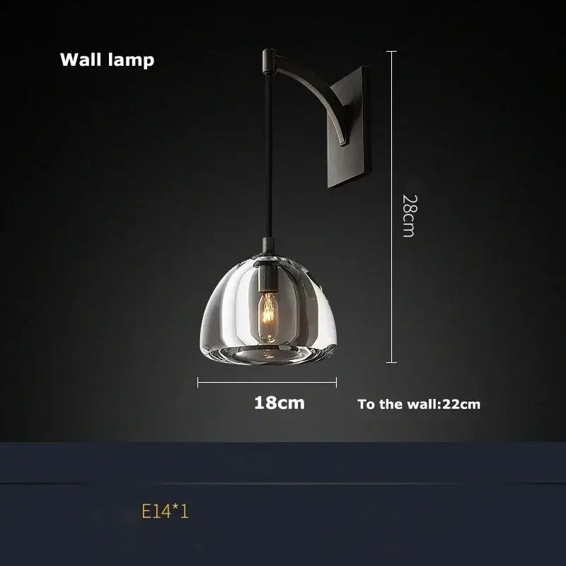 A decorbites black brass retro pendant light with a transparent glass dome and exposed filament bulb for dining room decor