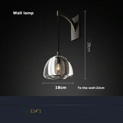 A decorbites black brass retro pendant light with a transparent glass dome and exposed filament bulb for dining room decor
