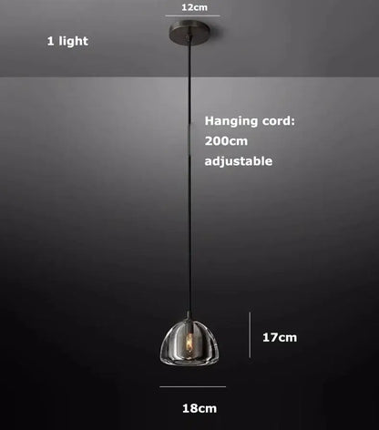 A sleek retro black brass pendant light with clear crystal glass dome and black metal cord for dining room decorbites black brass