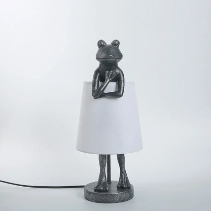 Retro black frog resin desk lamp features a dark gray textured frog base with a white lampshade for bedroom lighting decorbites frog resin