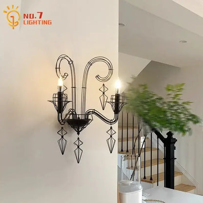Retro black iron candle wall lamp with ornate scrollwork and geometric crystal accents for living room wall lamp