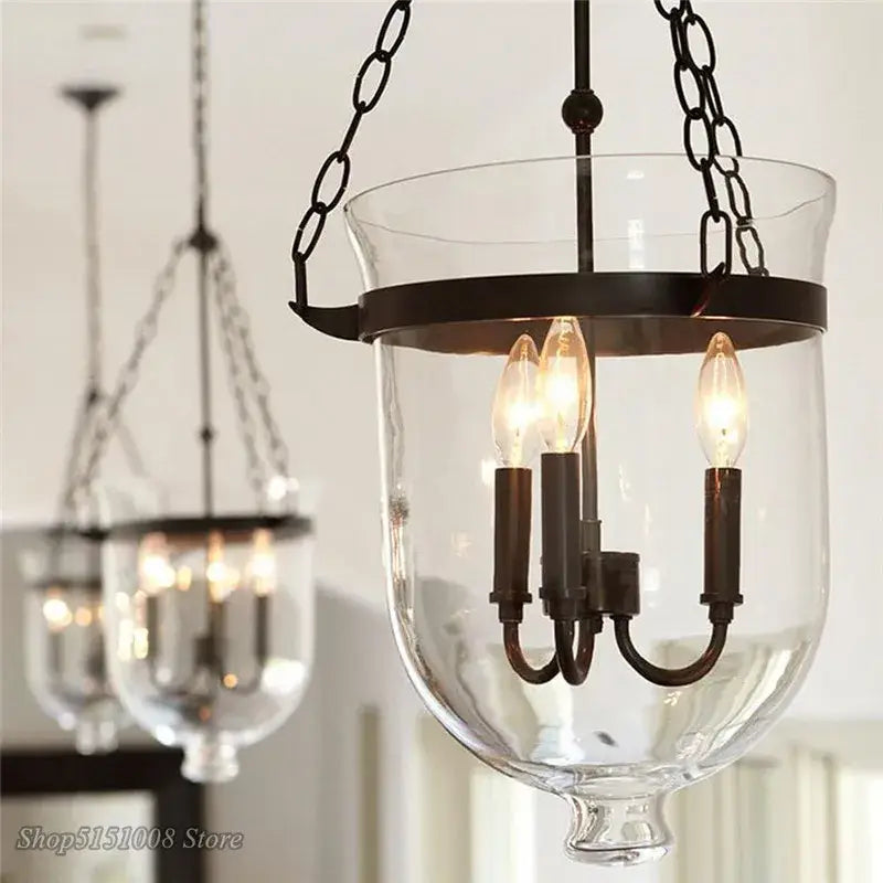 Retro black metal glass bucket pendant light with clear glass lantern and three candle-style bulbs for dining room decorbites