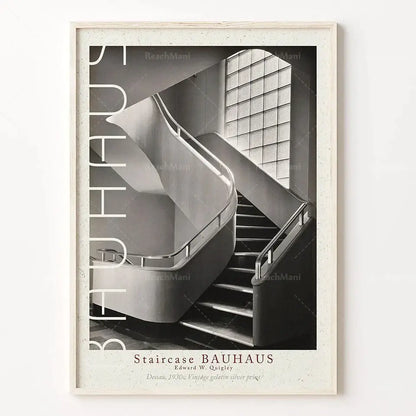 A framed black and white bauhaus stairs canvas print with bold typography in a textured off-white frame for living room wall art
