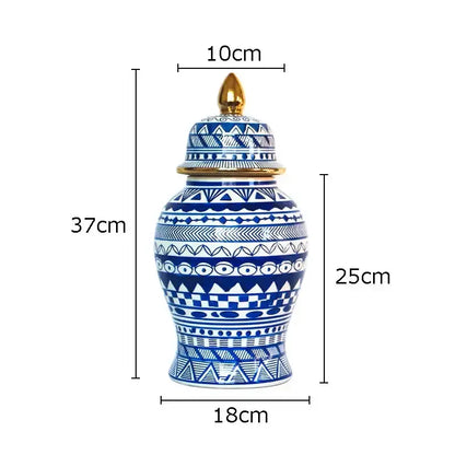 A tall 37cm white porcelain ginger jar with blue geometric patterns and a gold-toned lid from decorbites blue