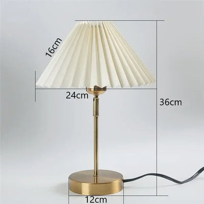 Cream-colored pleated table lamp with brass finish and dimensions marked from decorbites adjustable pleated collection