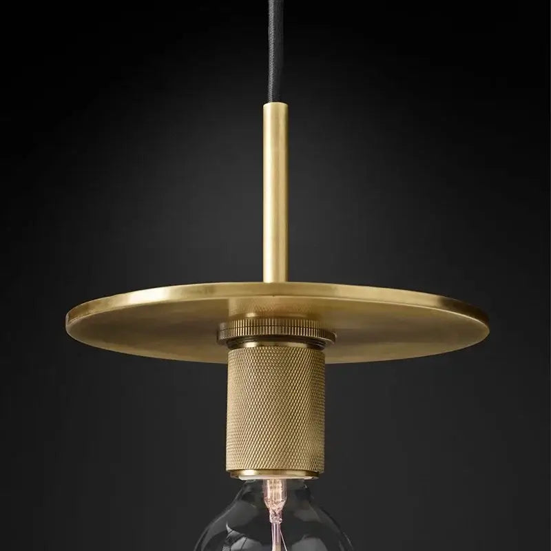 Retro brass and glass led pendant light with brass circular disc and textured cylindrical base for dining room decorbites gold led