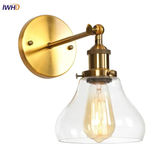 Retro brass and glass wall sconce with clear glass shade and exposed filament bulb for decorbites gold led wall use