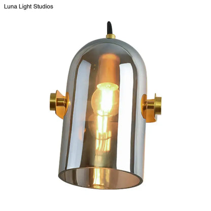 Chrome finished cloche sconce light with brass accents and clear glass dome for bedroom with retro blue glass design