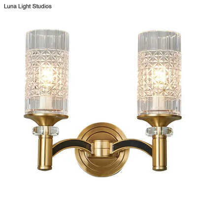 Brass-finished retro wall light with two crystal-cut glass shades and black trim for living room sconce lighting