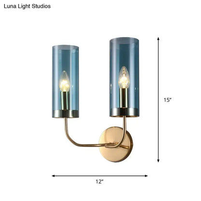 Retro brass wall mount lamp with smoked blue glass shade and brass-finished metal arms for living room use